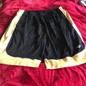 Black with gold basketball shorts.